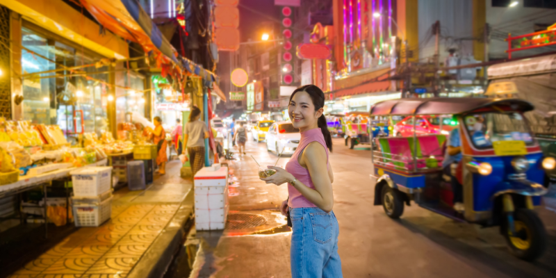 Young woman on a street food tour in Thailand